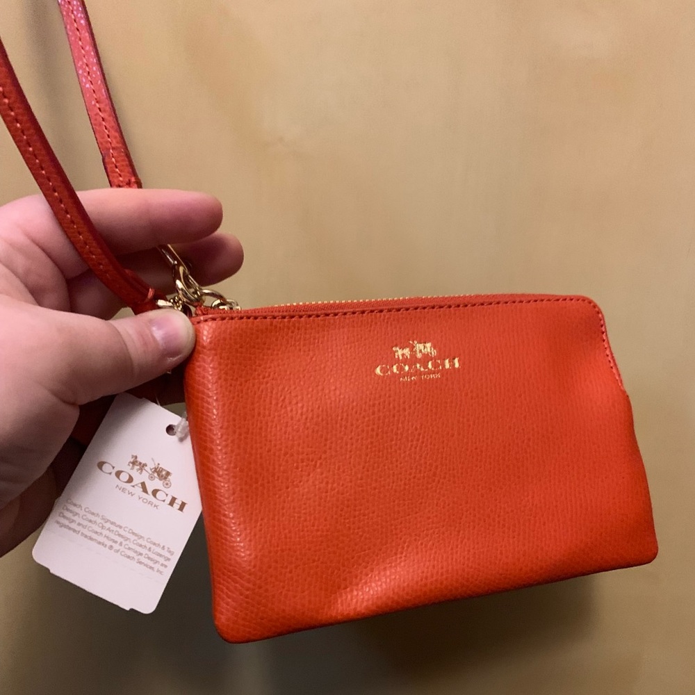 Orange Coach wristlet